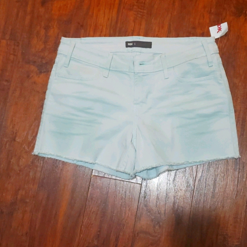 Levi's wash mint green shorts with raw hem Size 6/28